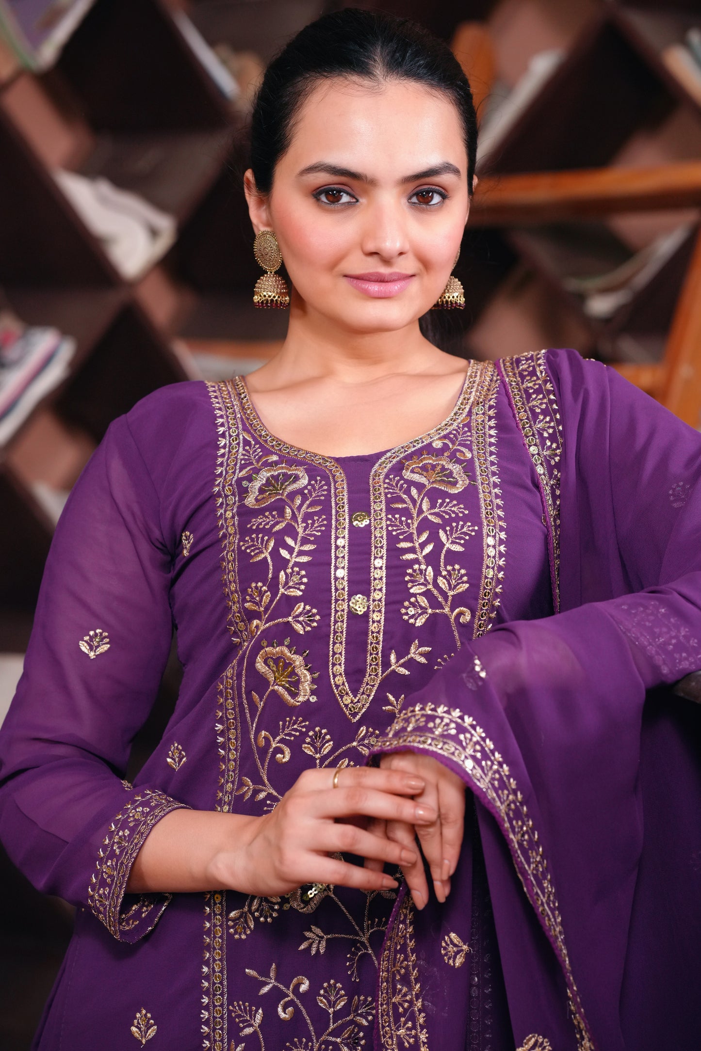 Purple Georgette Anarkali Suit with Intricate Golden Zari & Sequin Detailing Ask ChatGPT