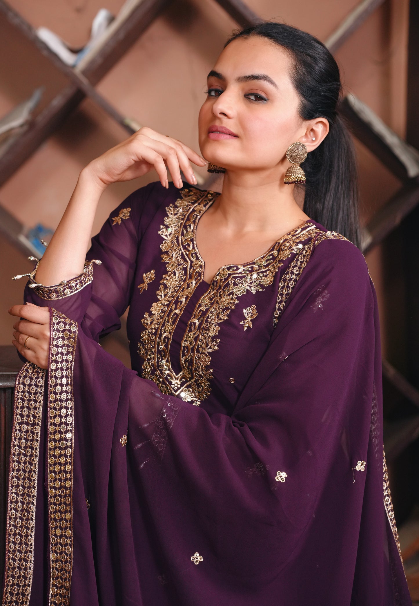 Purple Georgette Anarkali Suit with Intricate Golden Zari & Sequin Detailing Ask ChatGPT
