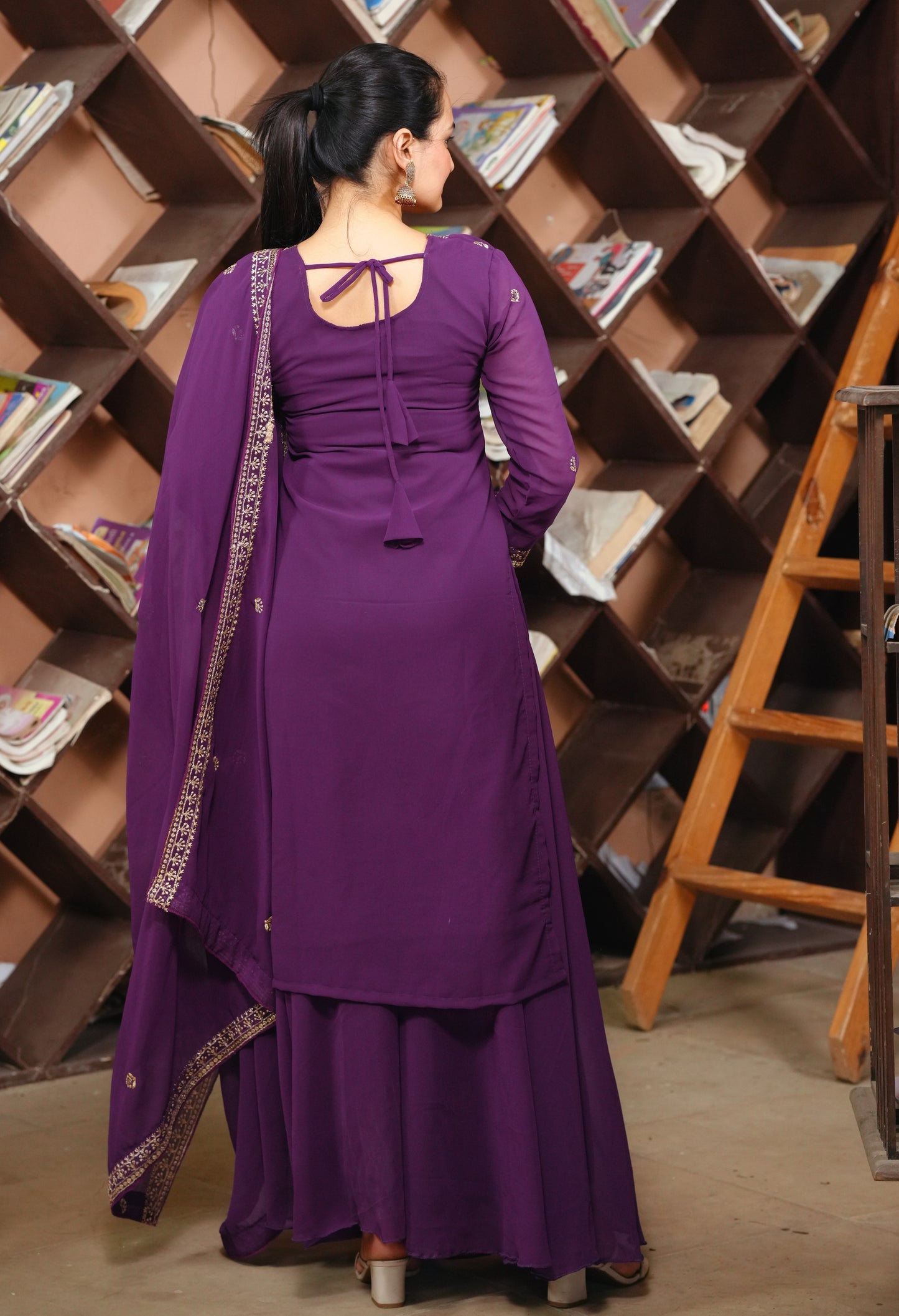 Purple Georgette Anarkali Suit with Intricate Golden Zari & Sequin Detailing Ask ChatGPT