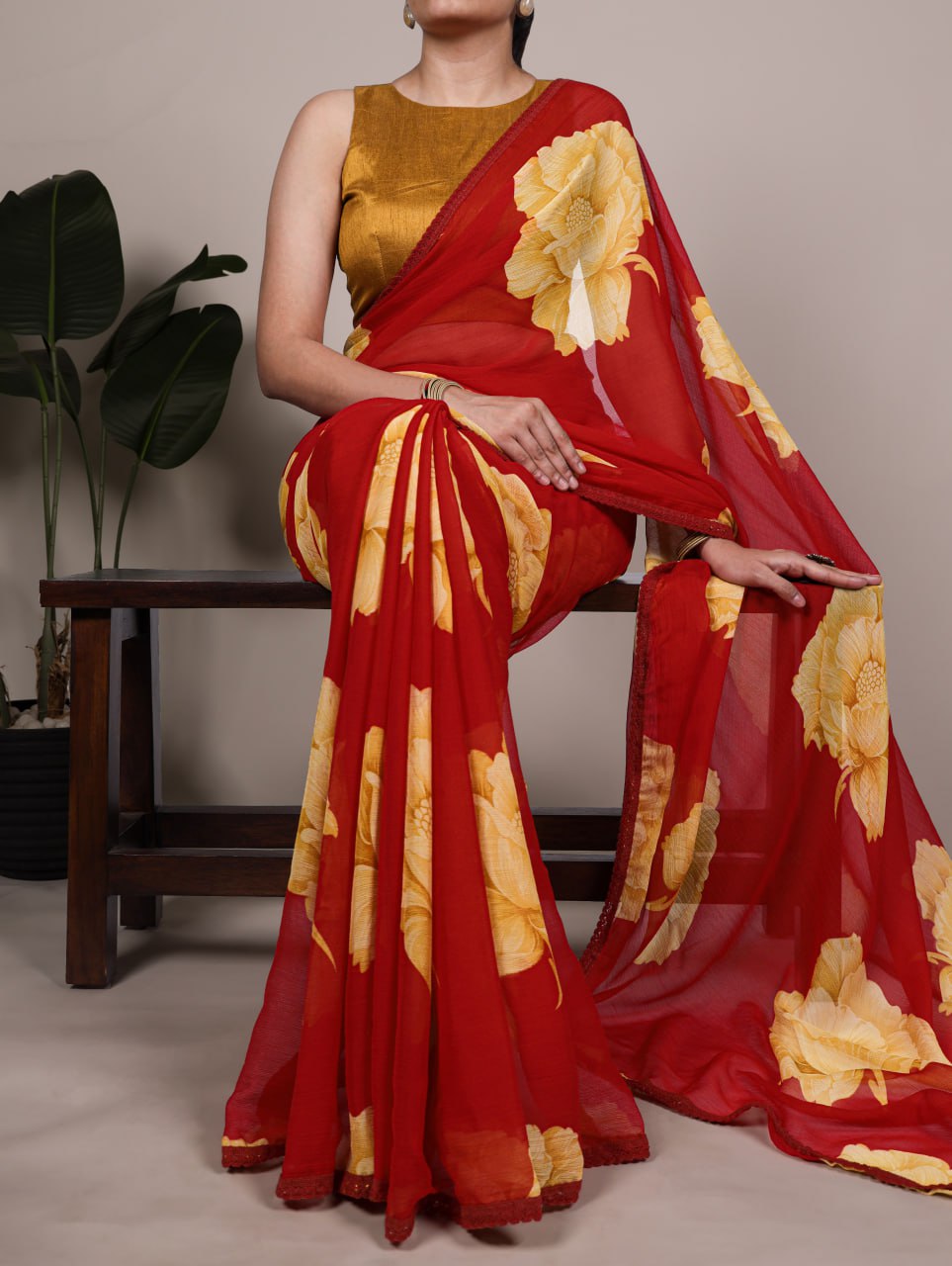 Red Chiffon Saree With A Yellow Floral Print And Lace Border