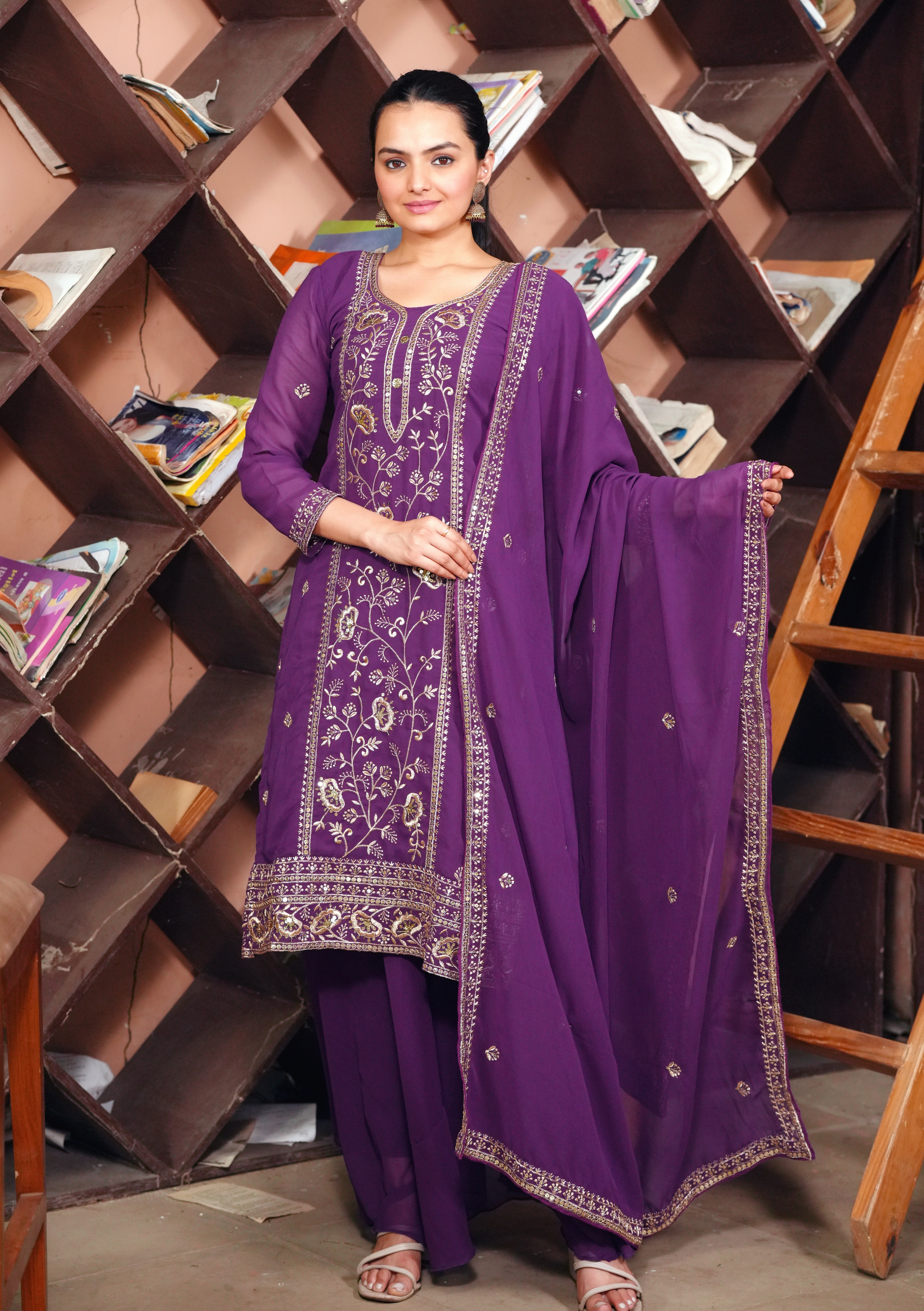Purple Georgette Anarkali Suit with Intricate Golden Zari & Sequin Detailing          Ask ChatGPT