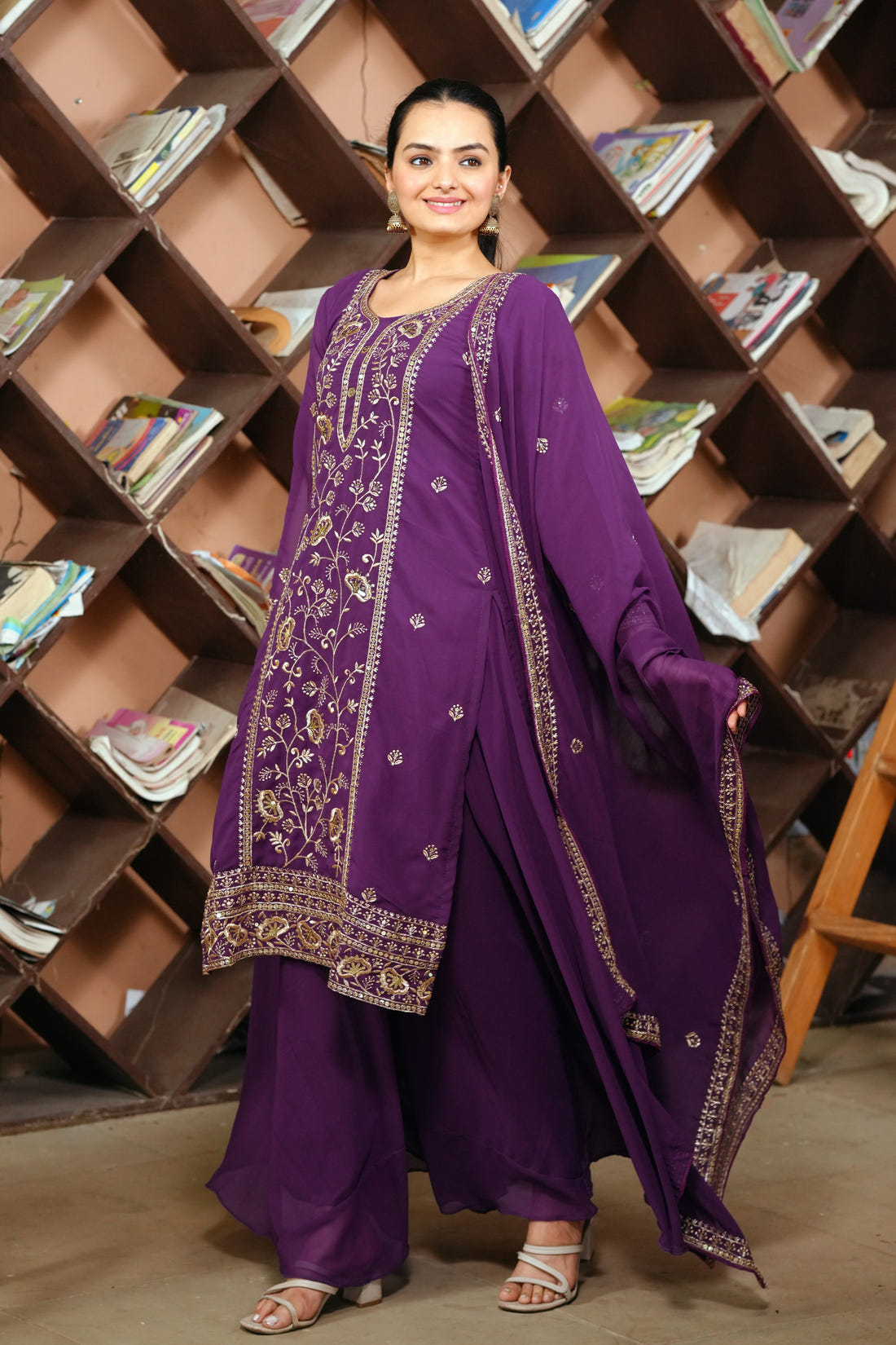 Purple Georgette Anarkali Suit with Intricate Golden Zari & Sequin Detailing          Ask ChatGPT