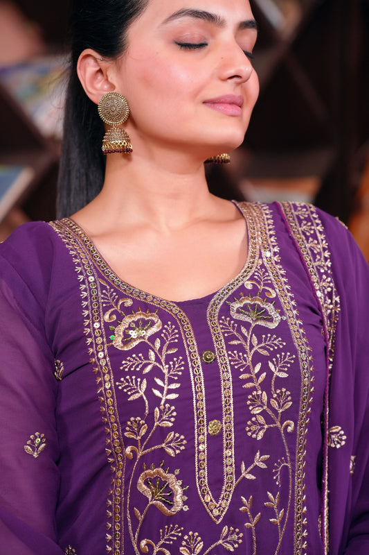 Purple Georgette Anarkali Suit with Intricate Golden Zari & Sequin Detailing          Ask ChatGPT