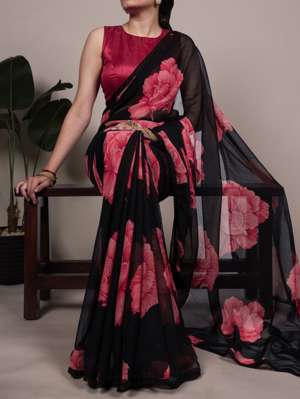 Black Chiffon Saree With A Pink Floral Print And Lace Border