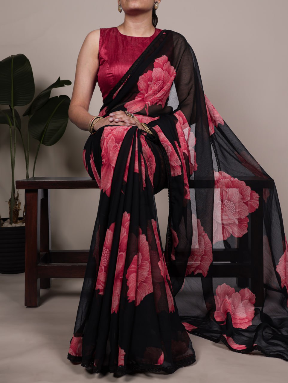 Black Chiffon Saree With A Pink Floral Print And Lace Border