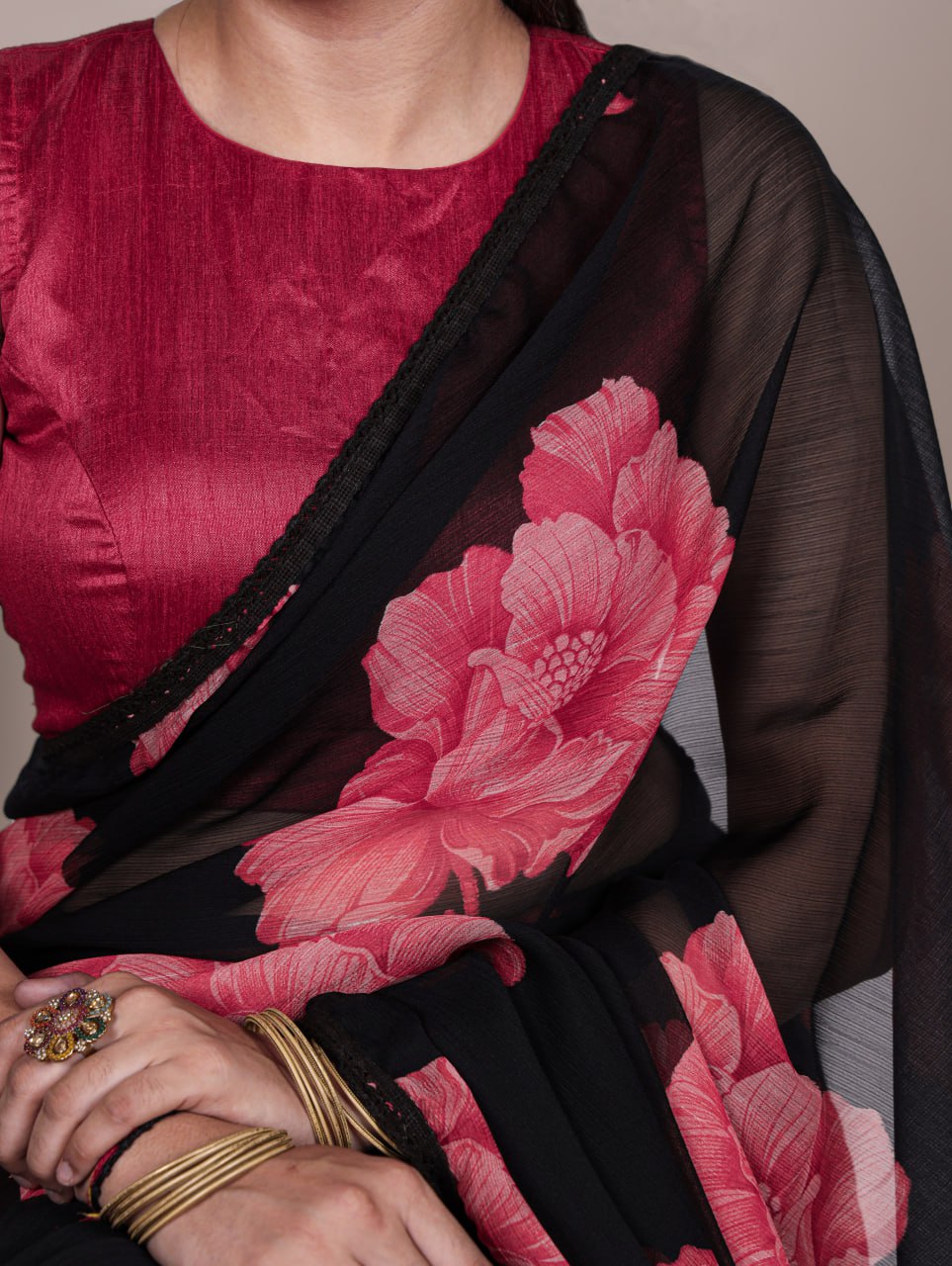 Black Chiffon Saree With A Pink Floral Print And Lace Border