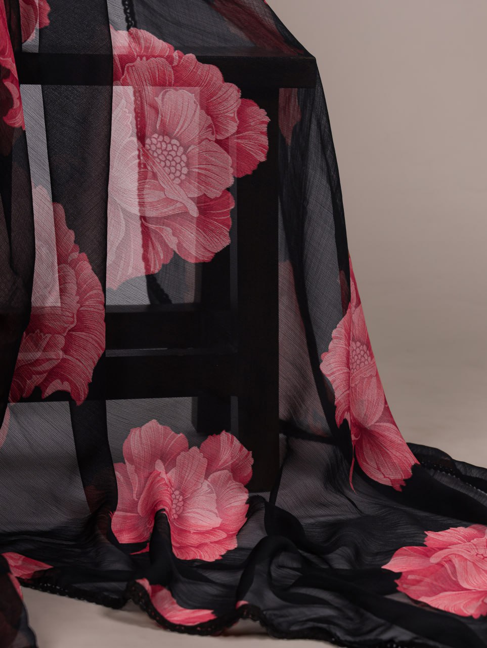 Black Chiffon Saree With A Pink Floral Print And Lace Border