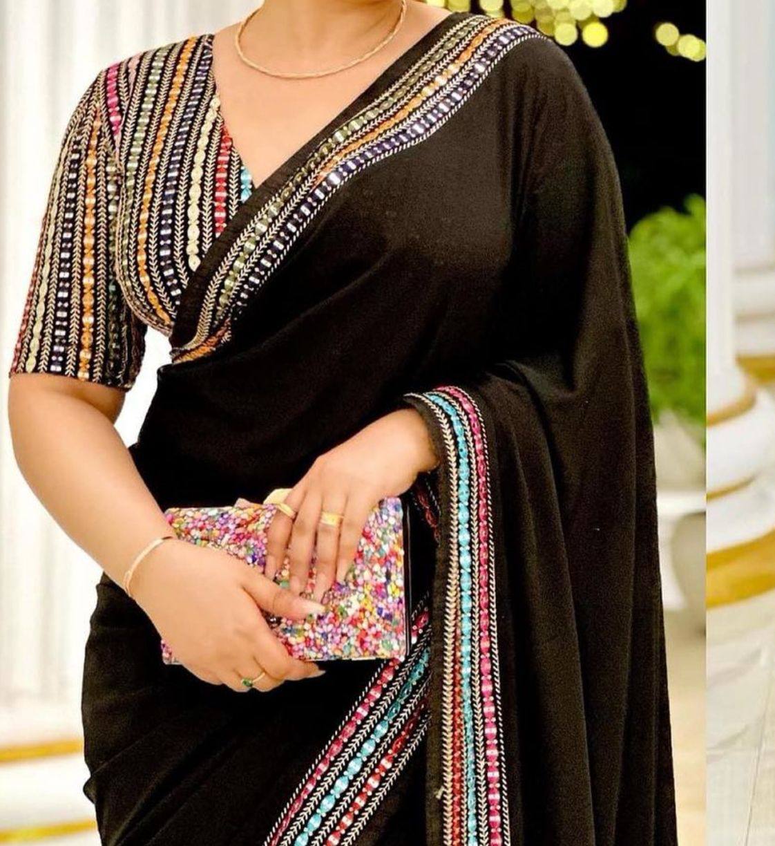 Black Elegant Georgette Saree with A Multicolour Embroidered Blouse