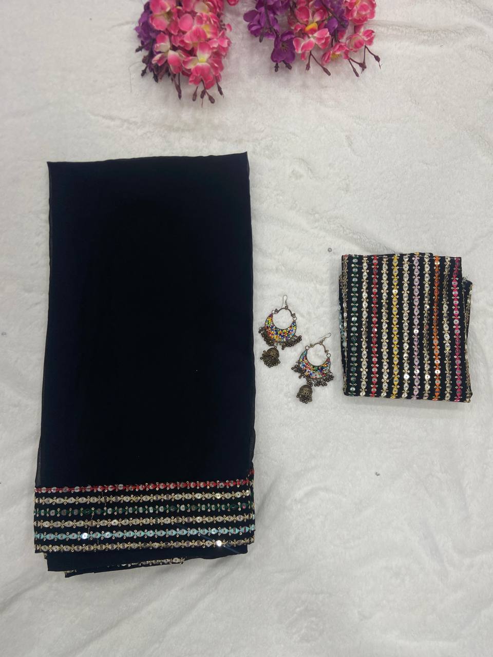 Black Elegant Georgette Saree with A Multicolour Embroidered Blouse