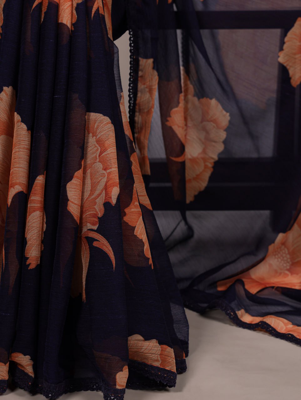 Navy Blue Chiffon Saree With A Orange Floral Print And Lace Border