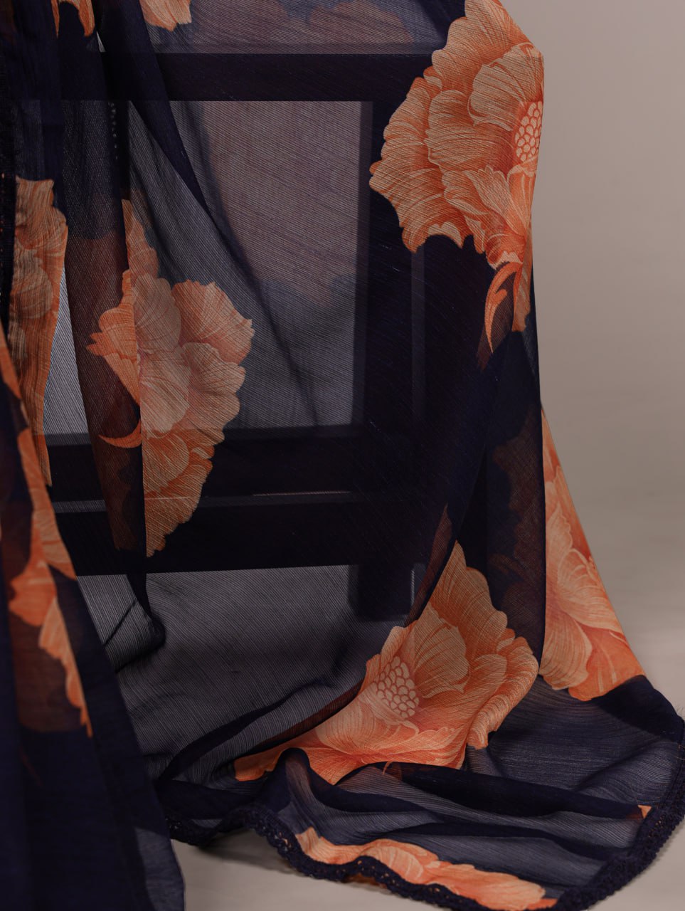 Navy Blue Chiffon Saree With A Orange Floral Print And Lace Border