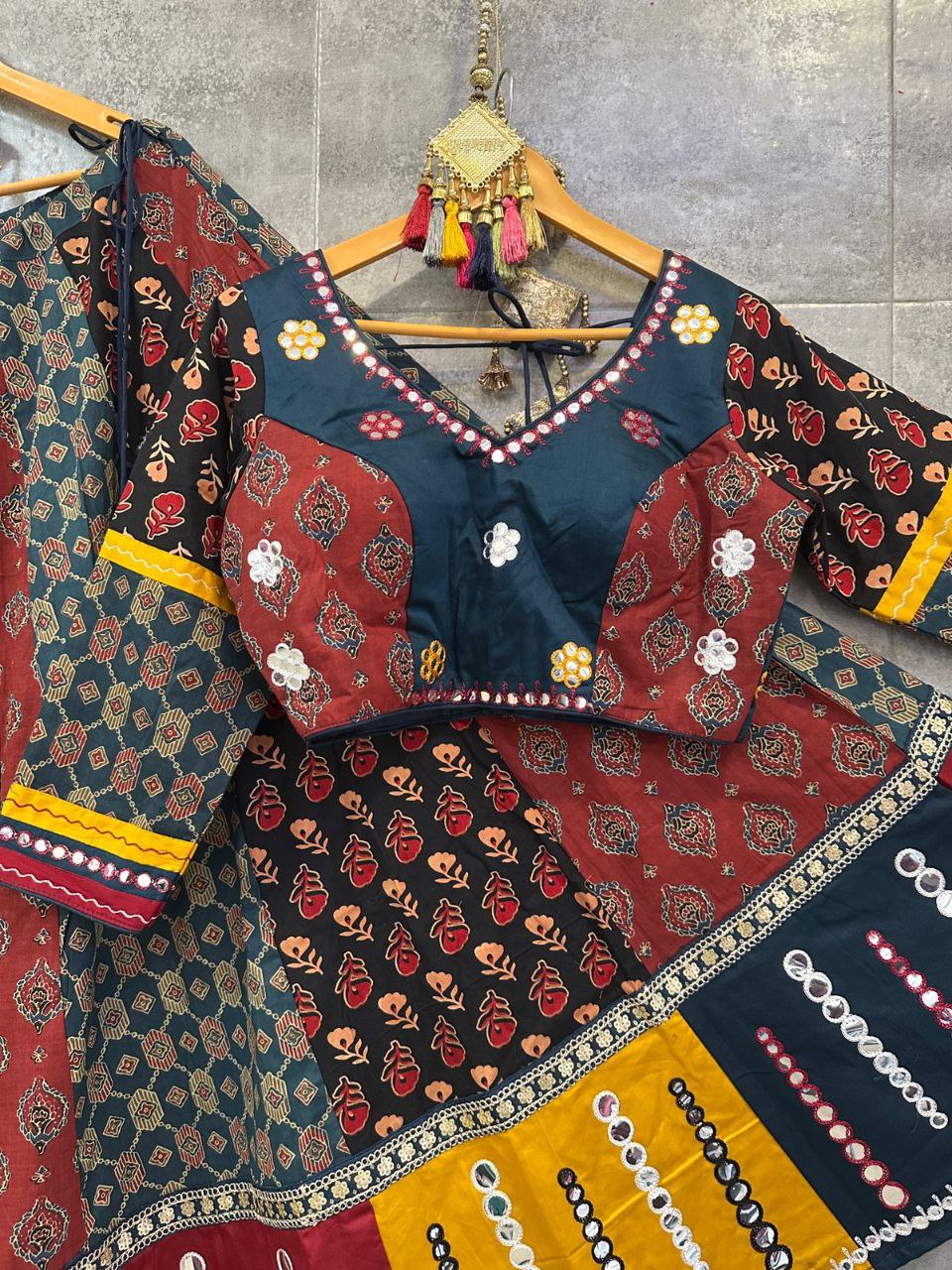 Rust Camric Cotton Chaniya Choli with Aari Work & Mirror Dupatta