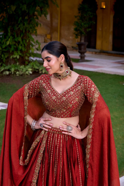 Designer Rust Orange Rangoli Silk Party Wear Lehenga Choli