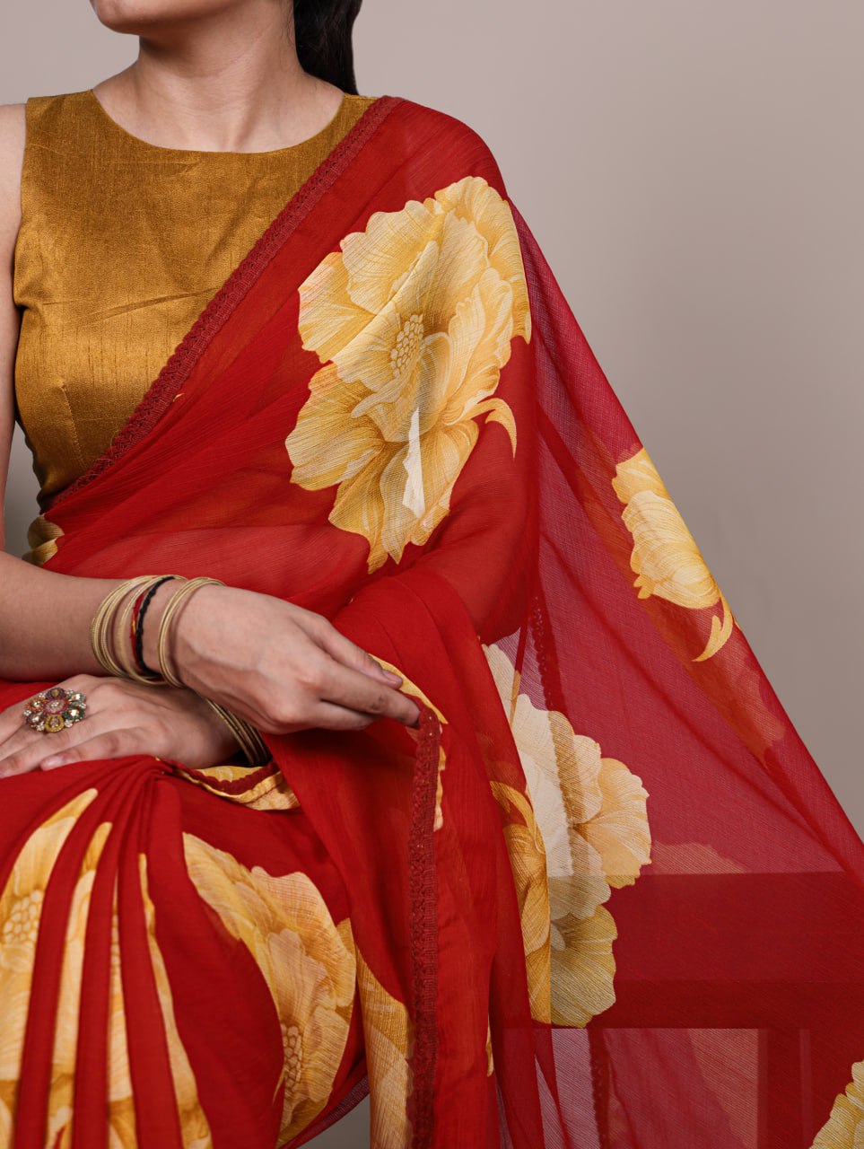 Red Chiffon Saree With A Yellow Floral Print And Lace Border