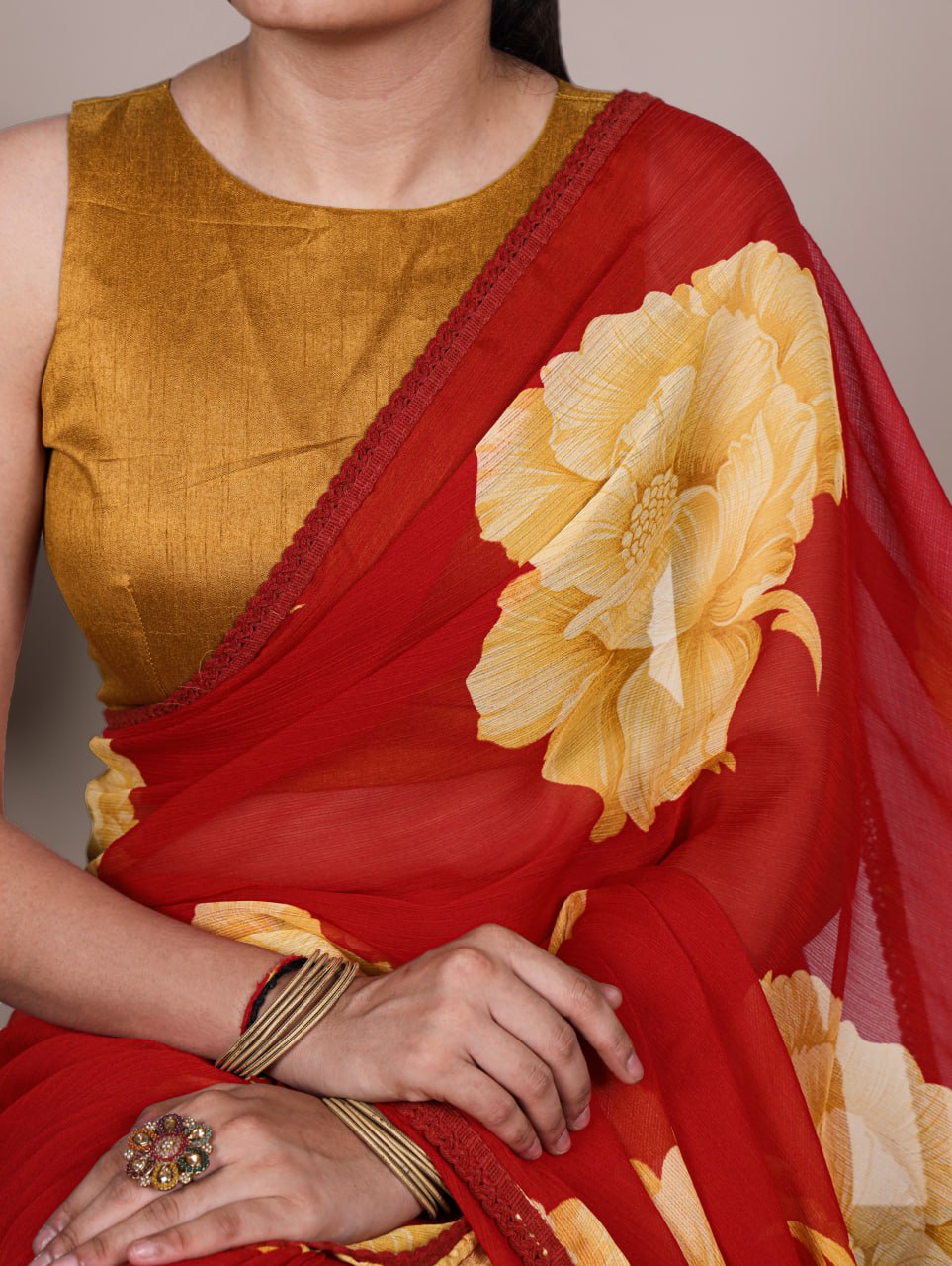 Red Chiffon Saree With A Yellow Floral Print And Lace Border