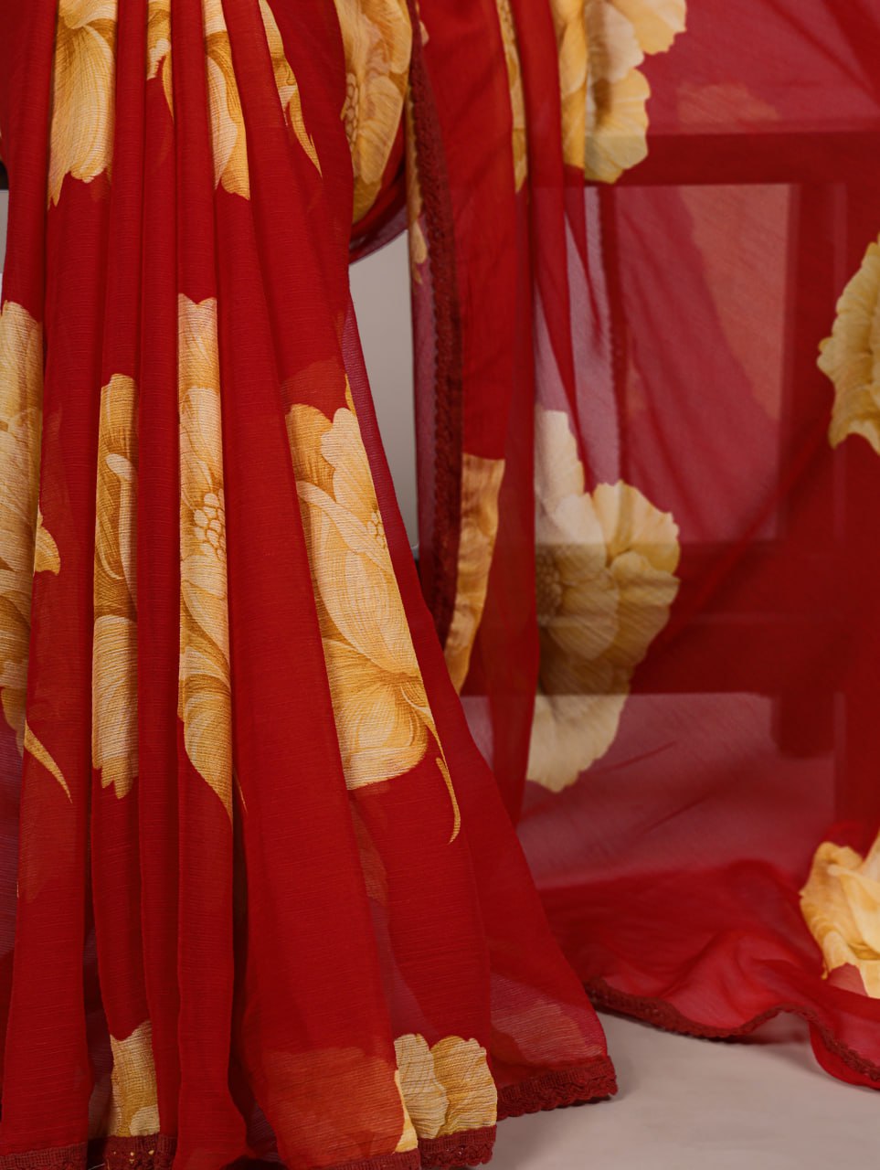 Red Chiffon Saree With A Yellow Floral Print And Lace Border