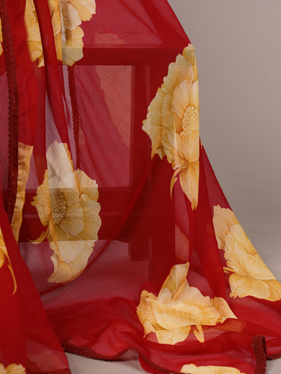 Red Chiffon Saree With A Yellow Floral Print And Lace Border