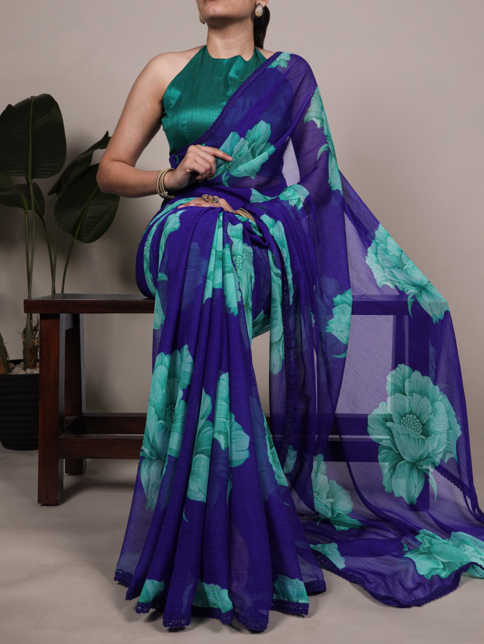 Royal Blue Chiffon Saree With A Floral Print And A Teal Green Blouse
