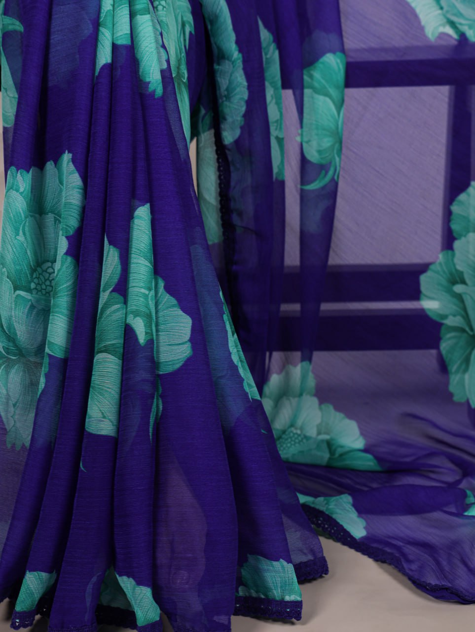 Royal Blue Chiffon Saree With A Floral Print And A Teal Green Blouse